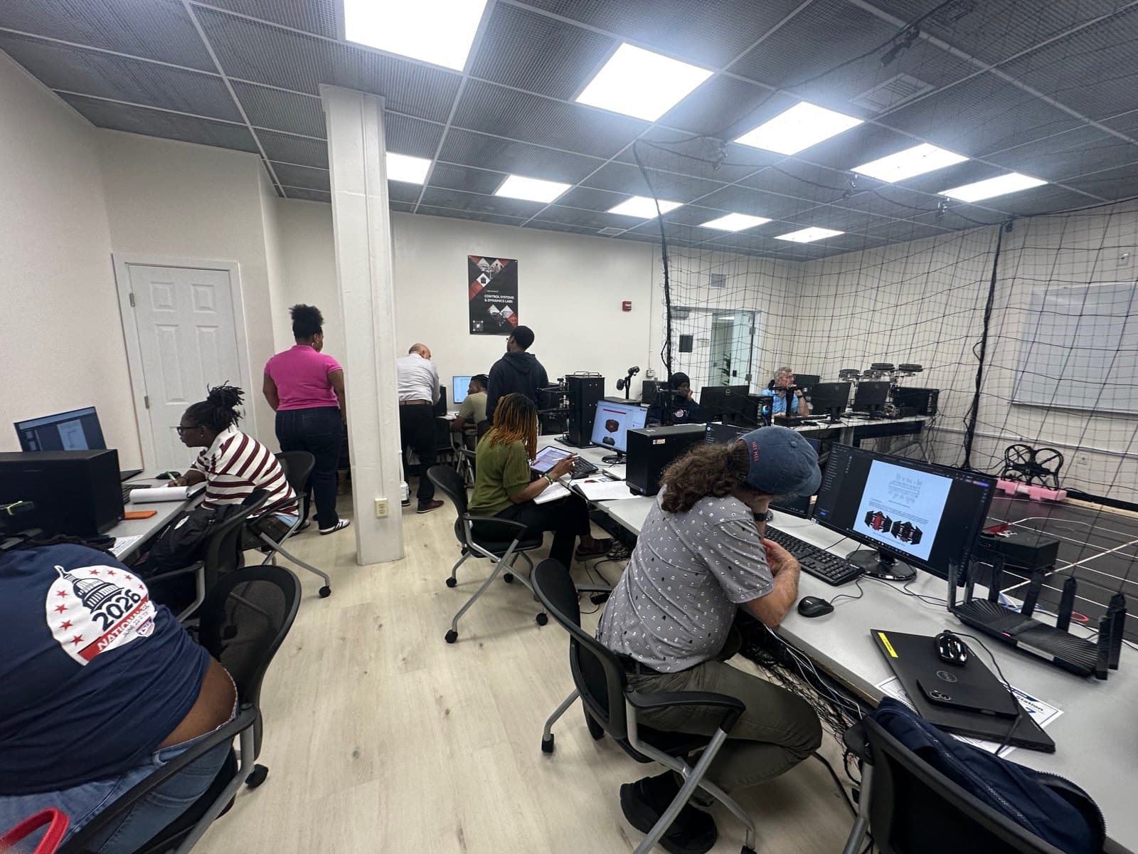 Educators working at computer stations in the AVRC Laboratory.