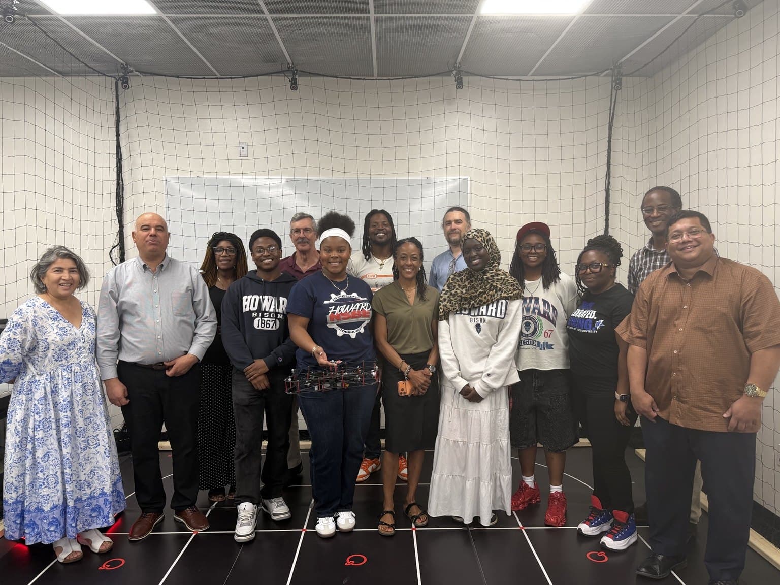 Dean Kimberly Jones of Howard University’s College of Engineering and Architecture visits with faculty and RAOP participants during the Thursday on-site session in the AVRC Laboratory.